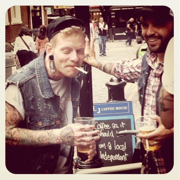 Tattoed guy with pint